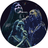 three women singing into microphones in a circle