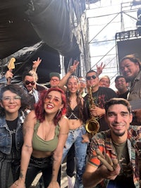 a group of people posing for a photo at a music festival